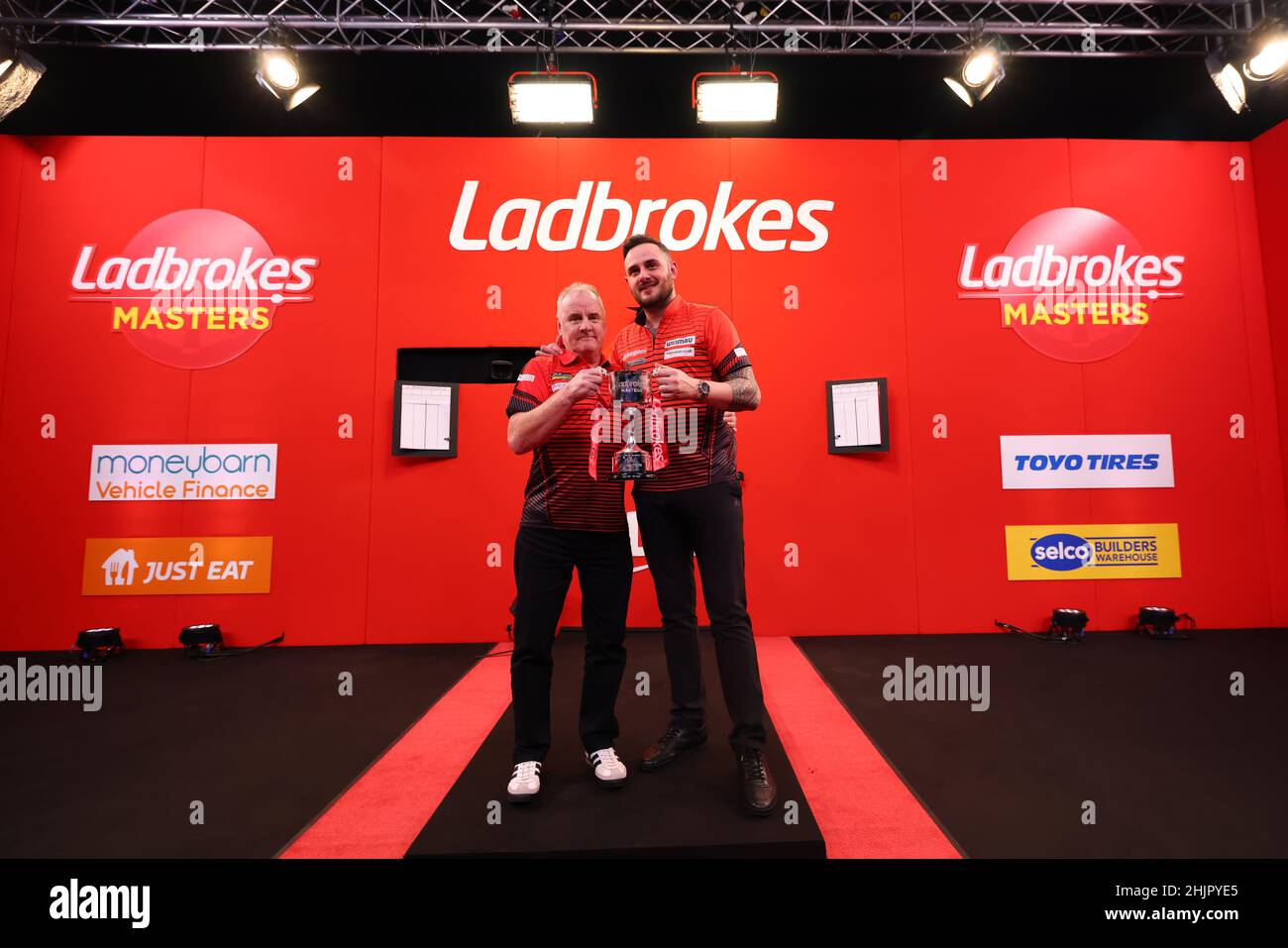30th January 2022; Marshall Arena, Milton Keynes, Bucks, England: Ladbrokes Masters Chisnall is presented with the runners up trophy by the sponsors Stock - Alamy