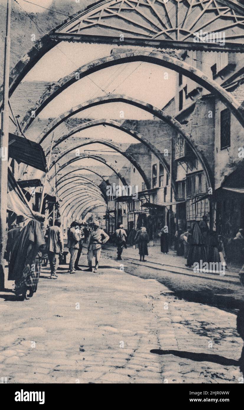 The scourge of Damascus has been fire, and surprisingly few antiquities are left. a fire destroyed the roof of his bazaar. Syria (1923) Stock Photo