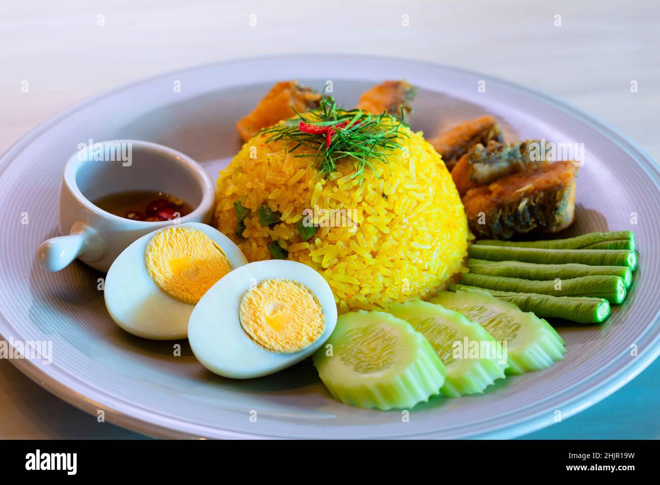 Sour Soup Fried Rice with Sea Bass,Dress the dish with fried fish