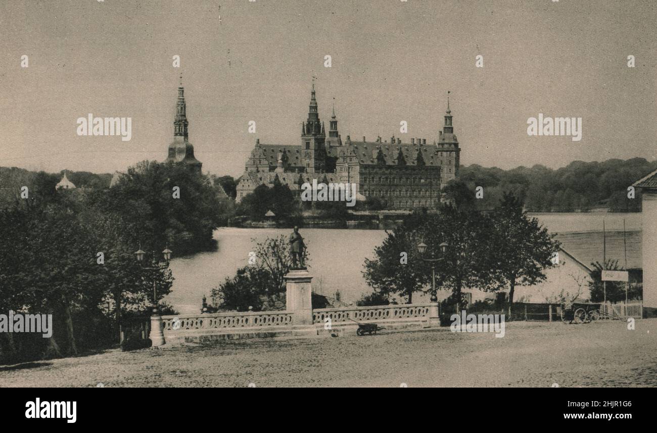 Fredericksborg Castle stands on an island in one of the Zealand lakes. it was built by Christian IV. in the 17C as a royal palace. Denmark (1923) Stock Photo