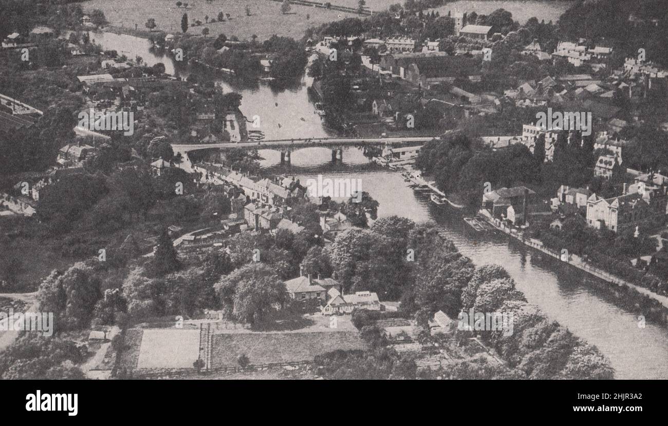 Staines, with the granite bridge over the Thames, looking up-stream towards Runnymede. Surrey. England (1923) Stock Photo