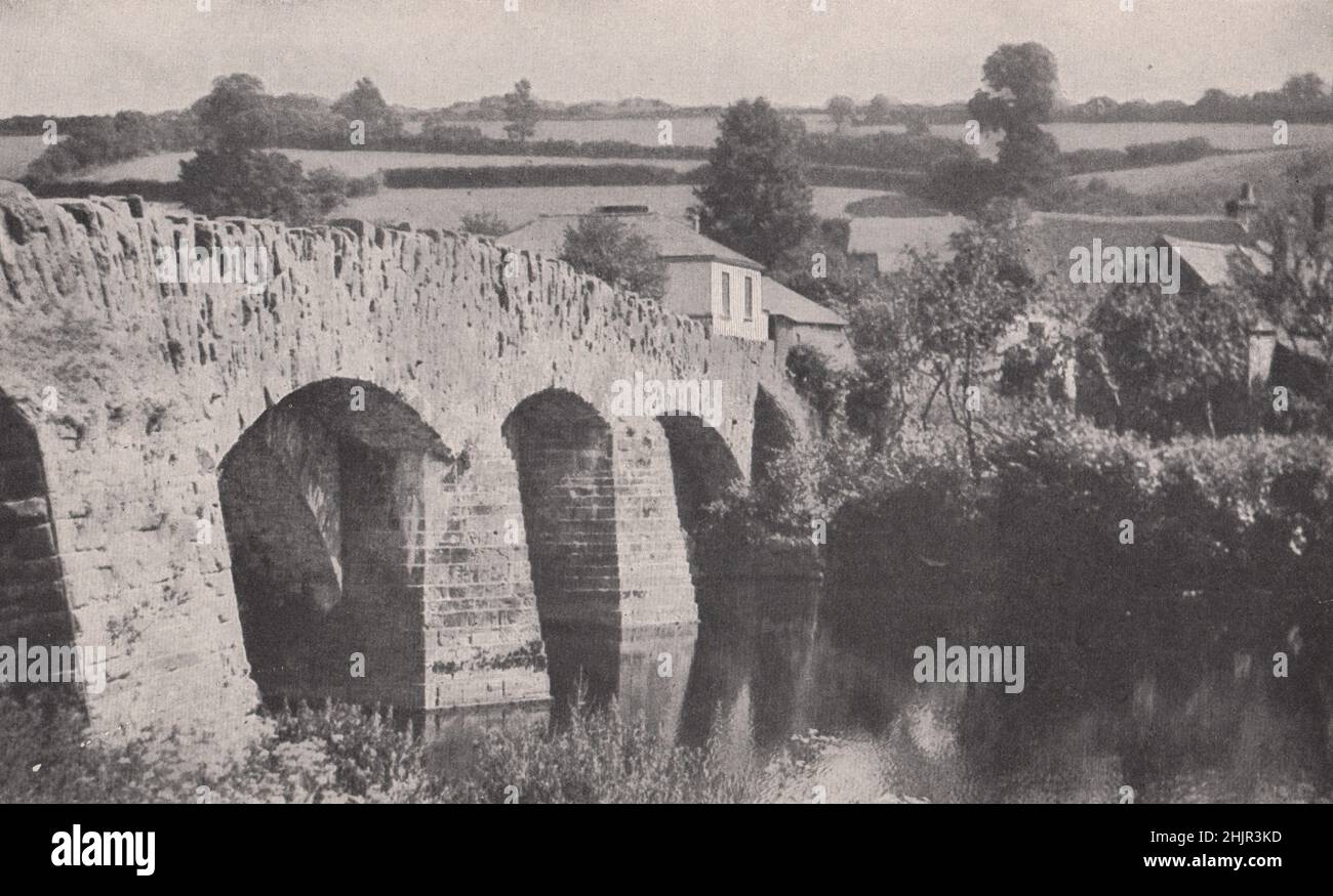 One of Torrington's three bridges over the Torridge on its course to Barnstaple Bay. Devon. England (1923) Stock Photo