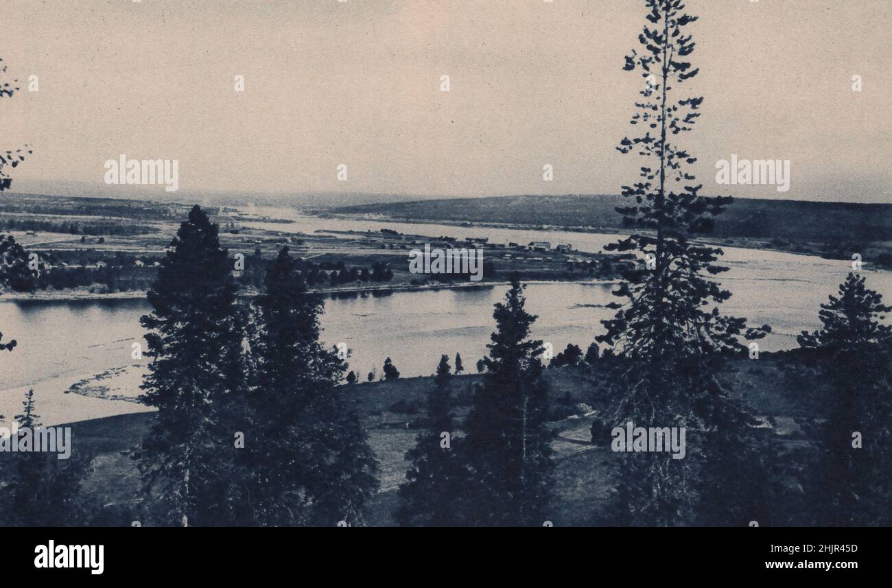 The Kemi river's majestic sweep past Rovaniemi, where from the north it descends into it the waters of the Ounas. Finland (1923) Stock Photo