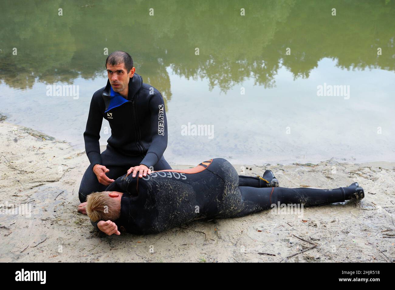 Lifeguards showing position of drowning body before doing mouthto