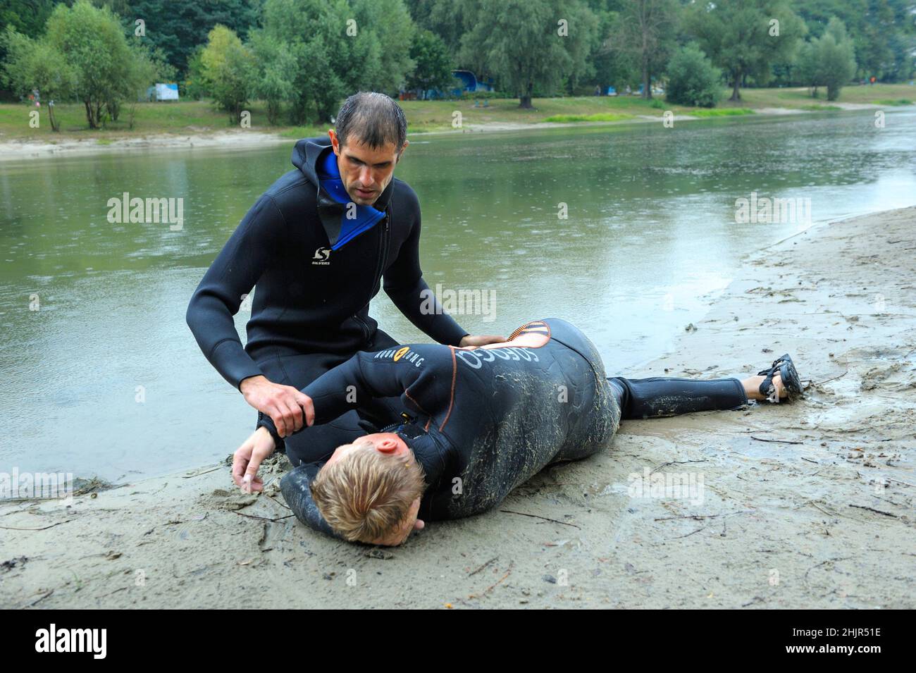 Lifeguards showing position of drowning body before doing mouthto