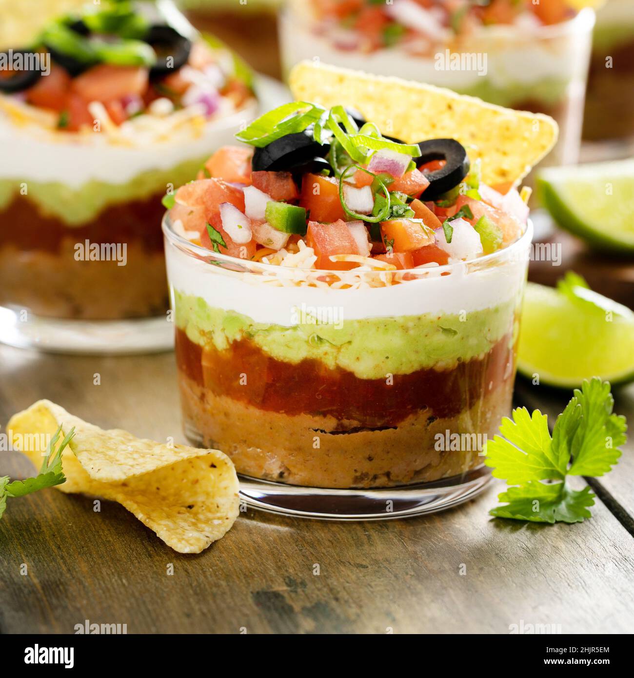 Seven layer dip in individual cups, mexican appetizer Stock Photo Alamy