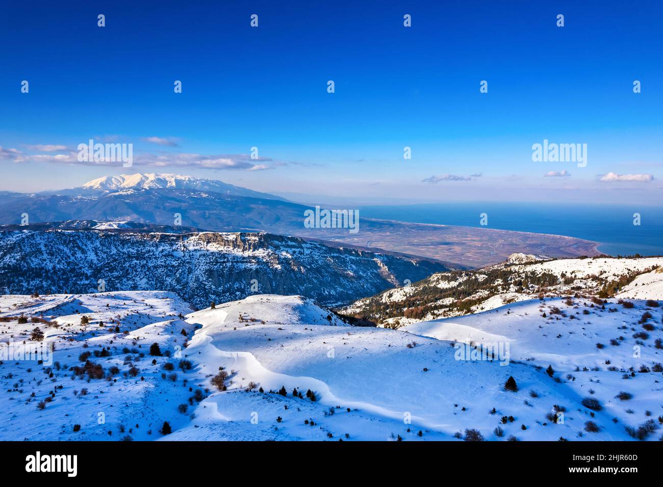 View of Kissavos mountain (1978 m.), Larissa, Thessaly, Greece. In the background the Aegean sea and Olympus mountain. Stock Photo