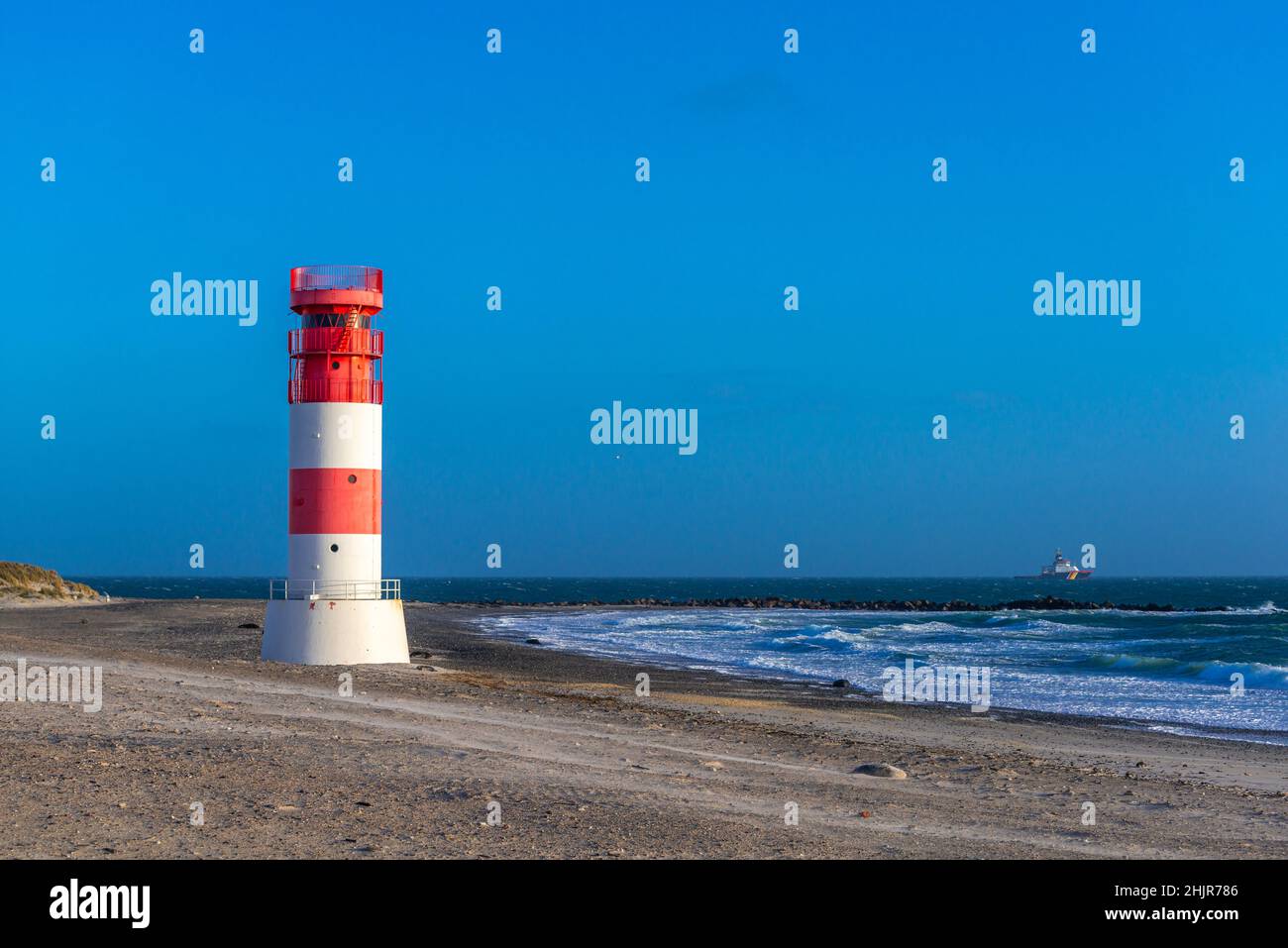 Lighthouse on the beach of The Dune, high seas island of Heligoland, North Sea, Northern Germany, Central Europe Stock Photo