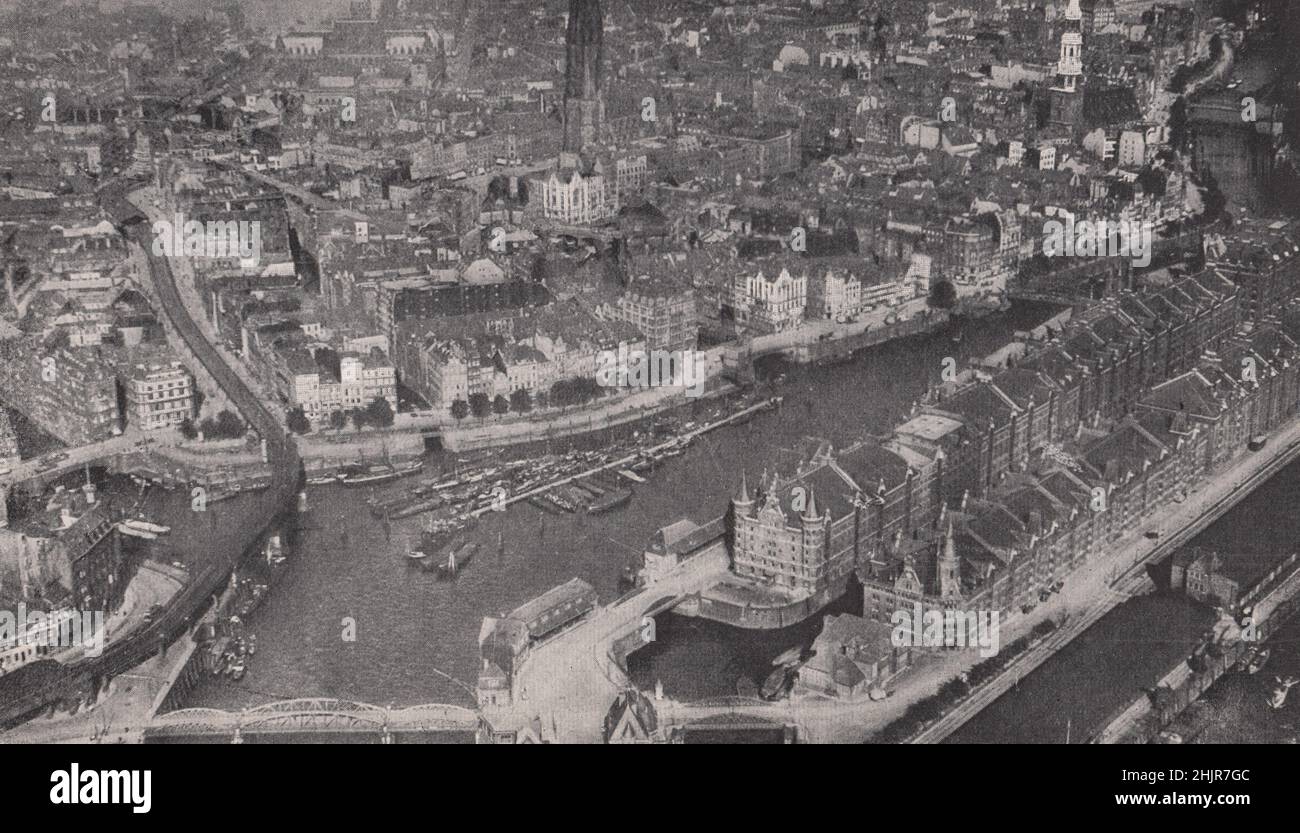 Inner harbour and the Zoll canal encircling the closely huddled old town. Germany. Hamburg (1923) Stock Photo