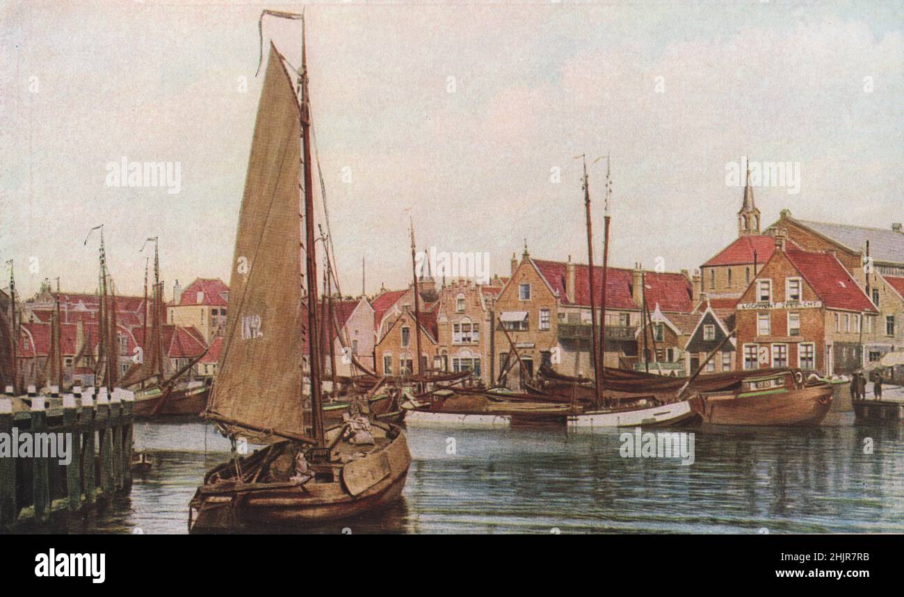 The harbour of the fishing Island of Urk, Zuider Zee, bristles with the tall masts of fishing smacks. Netherlands. Holland (1923) Stock Photo