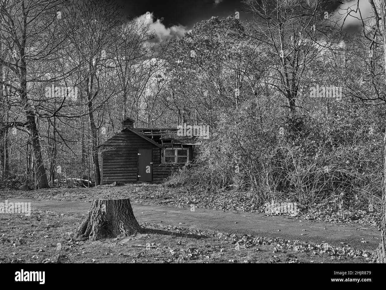 Black and white photo of an old abandoned and collapsing house. At the Palisades Interstate Park State Line Lookout in Alpine NJ. Stock Photo