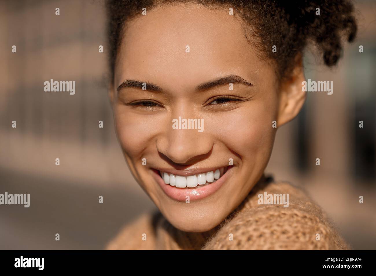 Close up face of happy girl with toothy smile Stock Photo