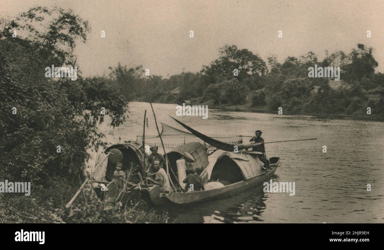 The Hué river flows to the China Sea. Its fish are caught by Annamese boatmen in their sampans, for the Chinese export trade. Vietnam (1923) Stock Photo