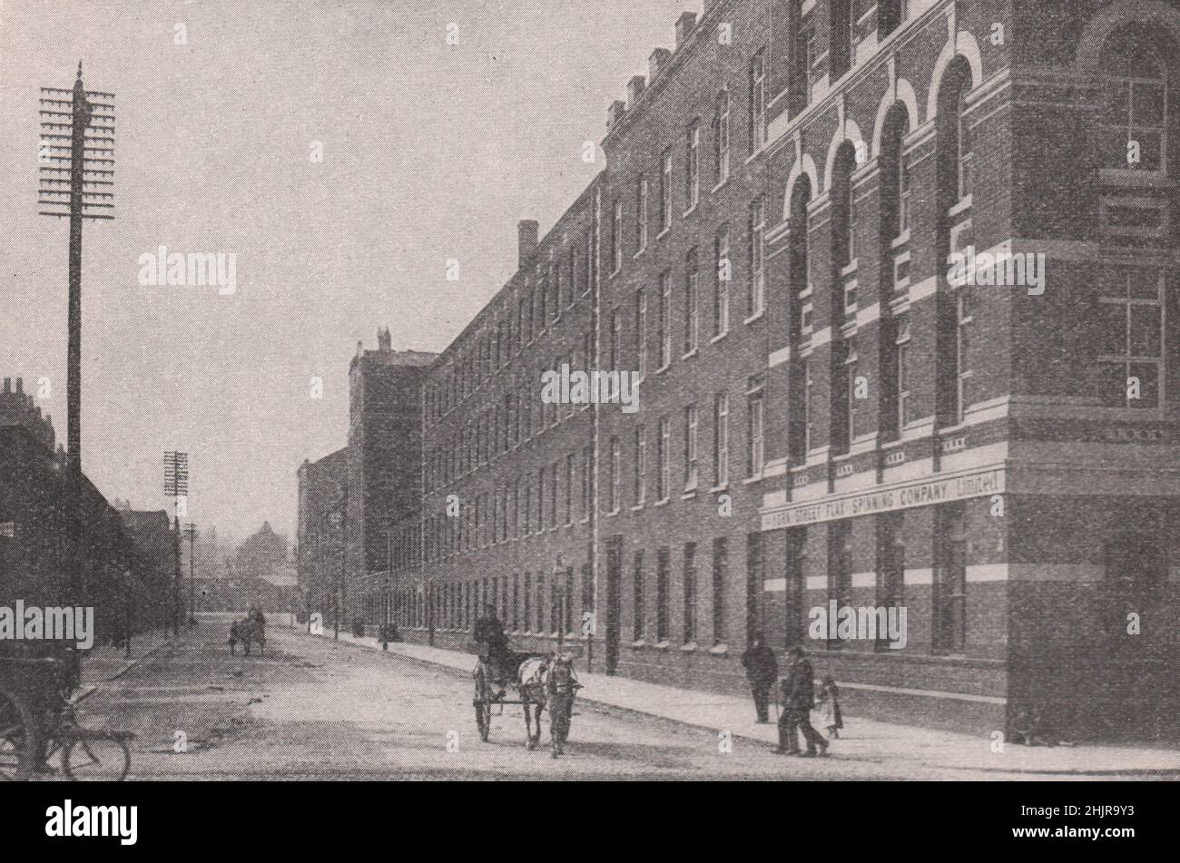 Sombre Street among the Drab flax mills of Belfast. Ireland (1923 Stock