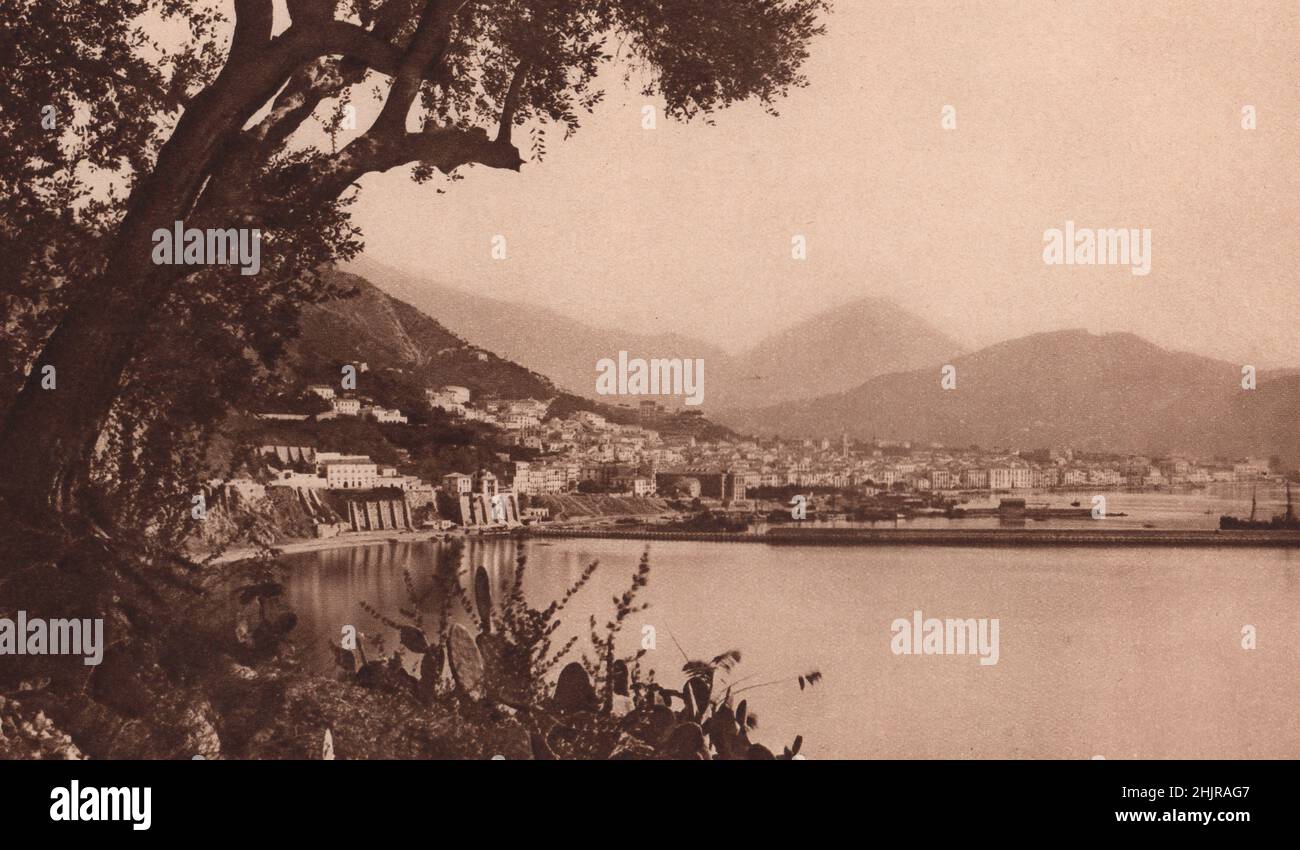 Esplanade at Salerno, the Corso Garibaldi. Behind, the town leans up towards a majesty of hills & in front is the Tyrrhenian (1923) Stock Photo