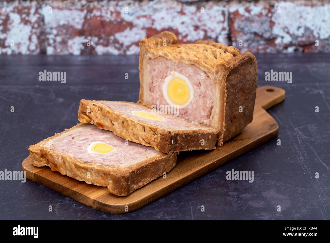 A sliced Gala ham and egg pie Stock Photo