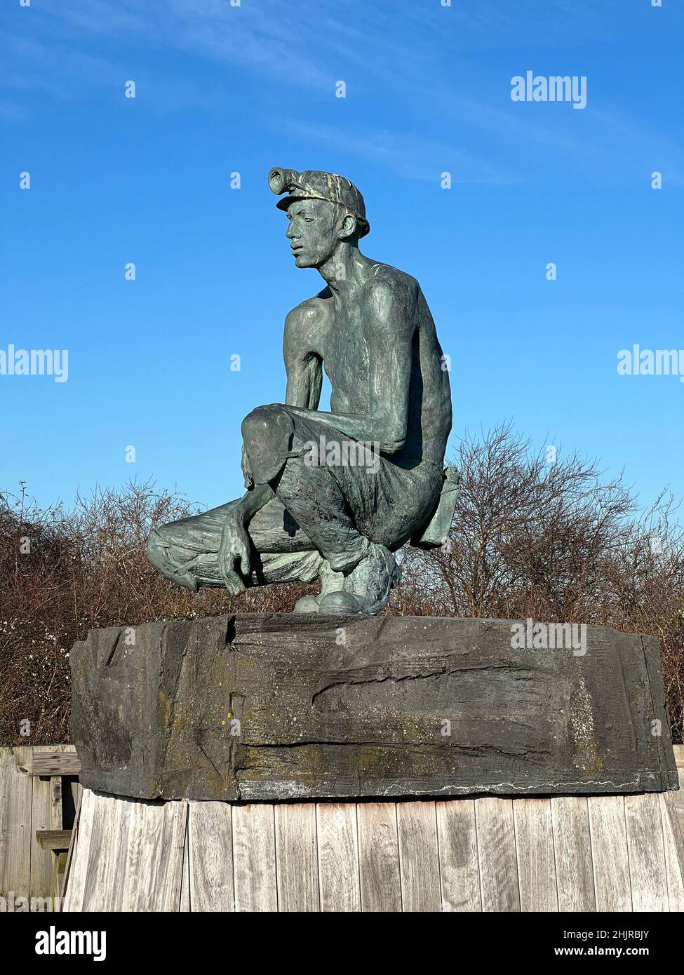 The Waiting Miner statue was relocated to Fowlmead Country Park, the former site of Betteshanger Colliery, in Kent, UK Stock Photo
