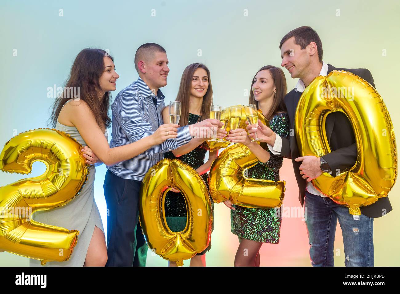 Happy company with champagne glasses celebrating new 2020 year Stock Photo