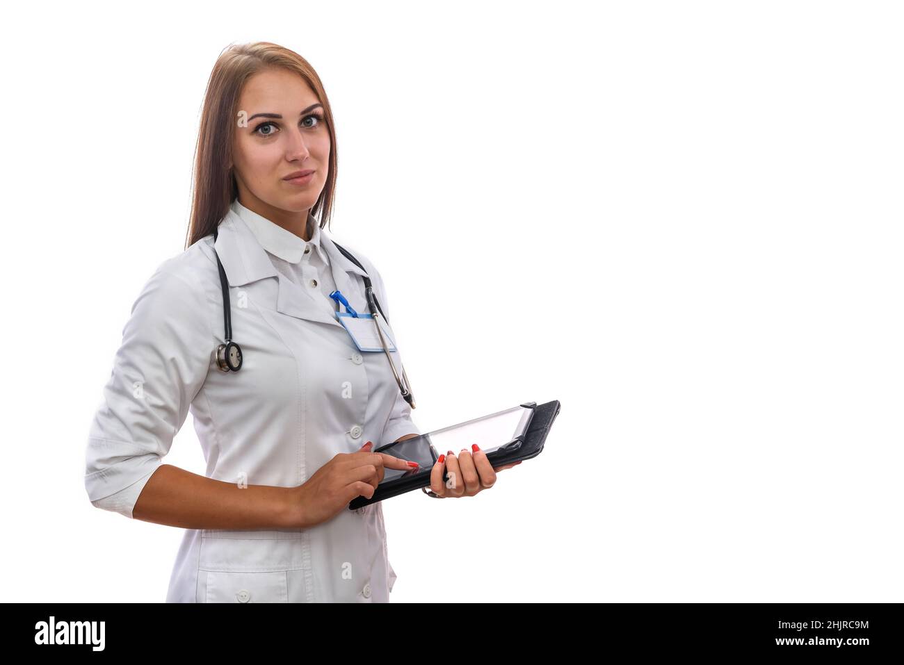 Tablet and medicine. Beautiful woman doctor holding tablet isolated on white. Using of modern devices in medical work Stock Photo