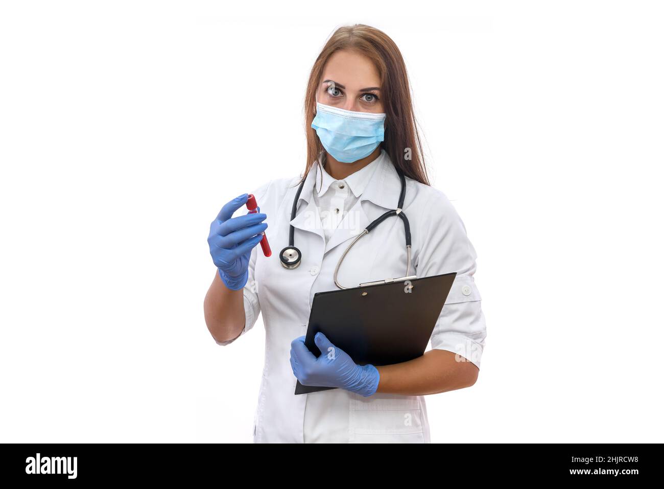 Attractive woman in medical uniform and protective mask holding red test tube isolated on white Stock Photo