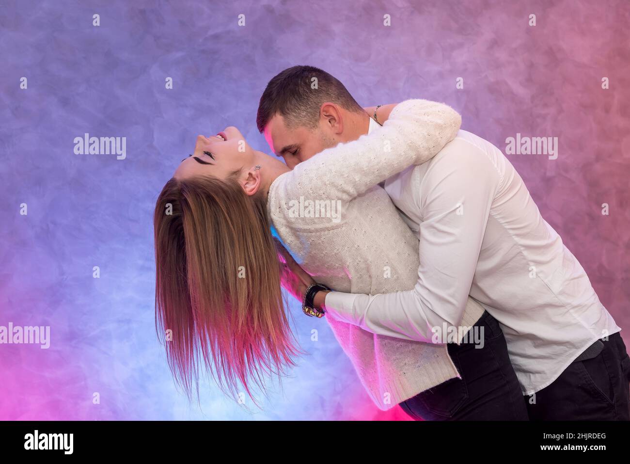 Couple in love posing hugging. Valentines day. Passion and feelings between young people Stock Photo