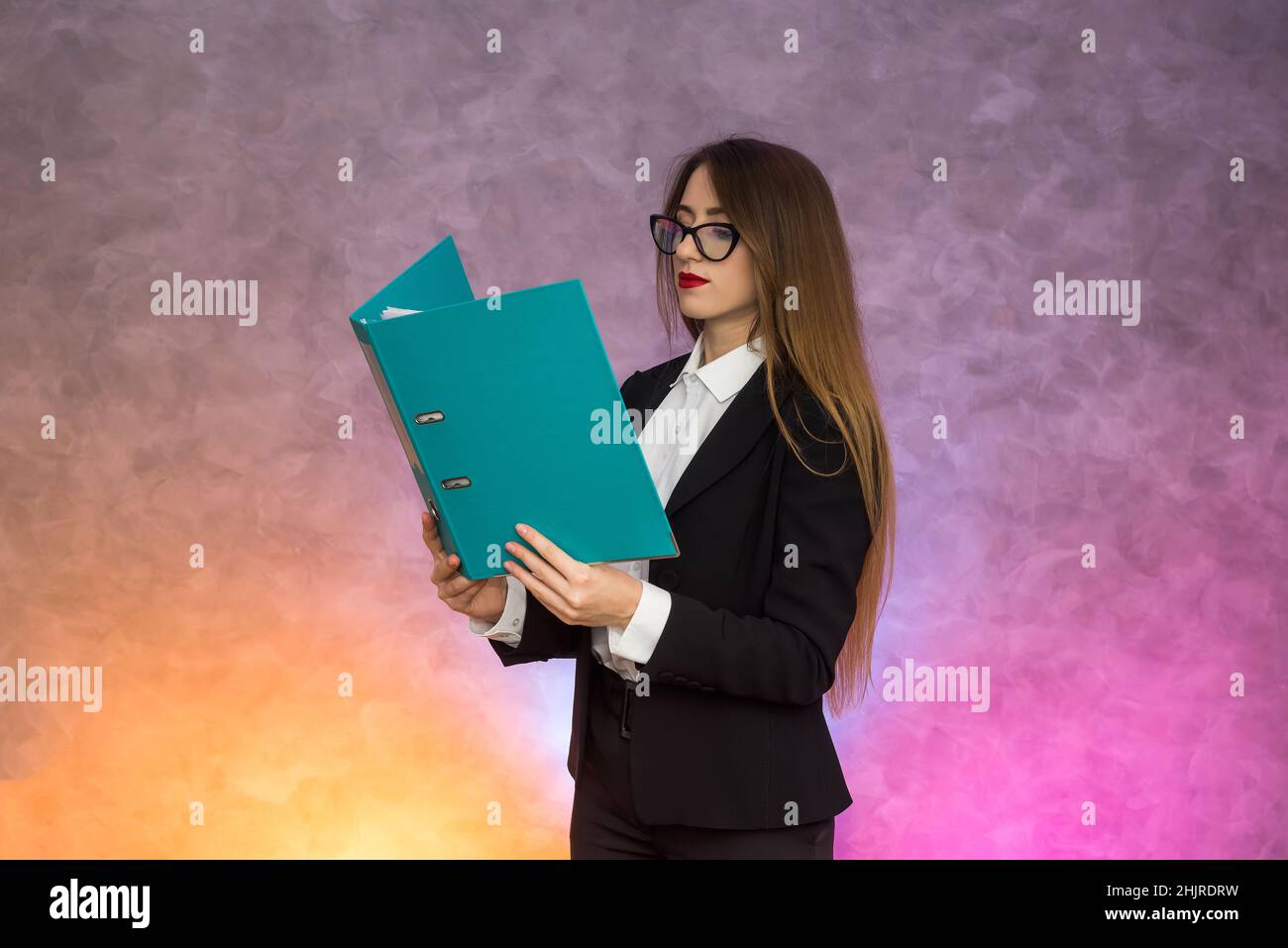 Attractive woman secretary holding folder. Business concept Stock Photo ...