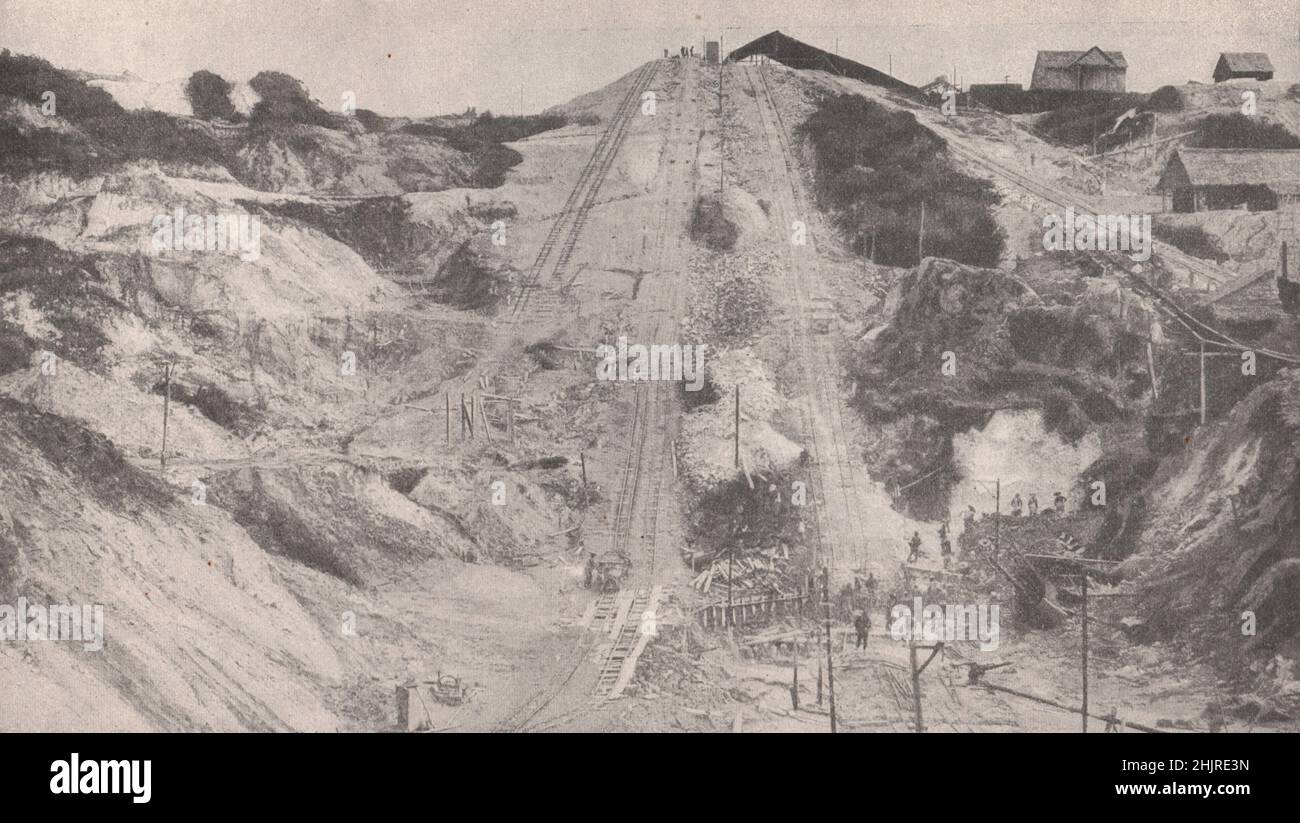 Lines and trucks in one of the many Tin-Mines operated by Chinese in Malaya. Malaysia (1923) Stock Photo