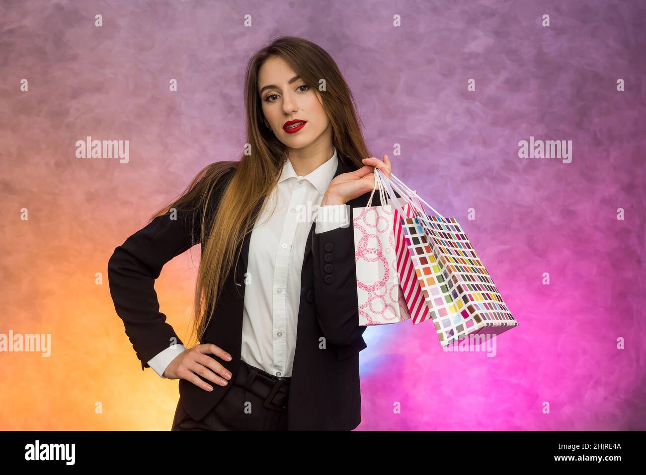 Happy woman with gift bags smiling. Shopping concept, black friday Stock Photo