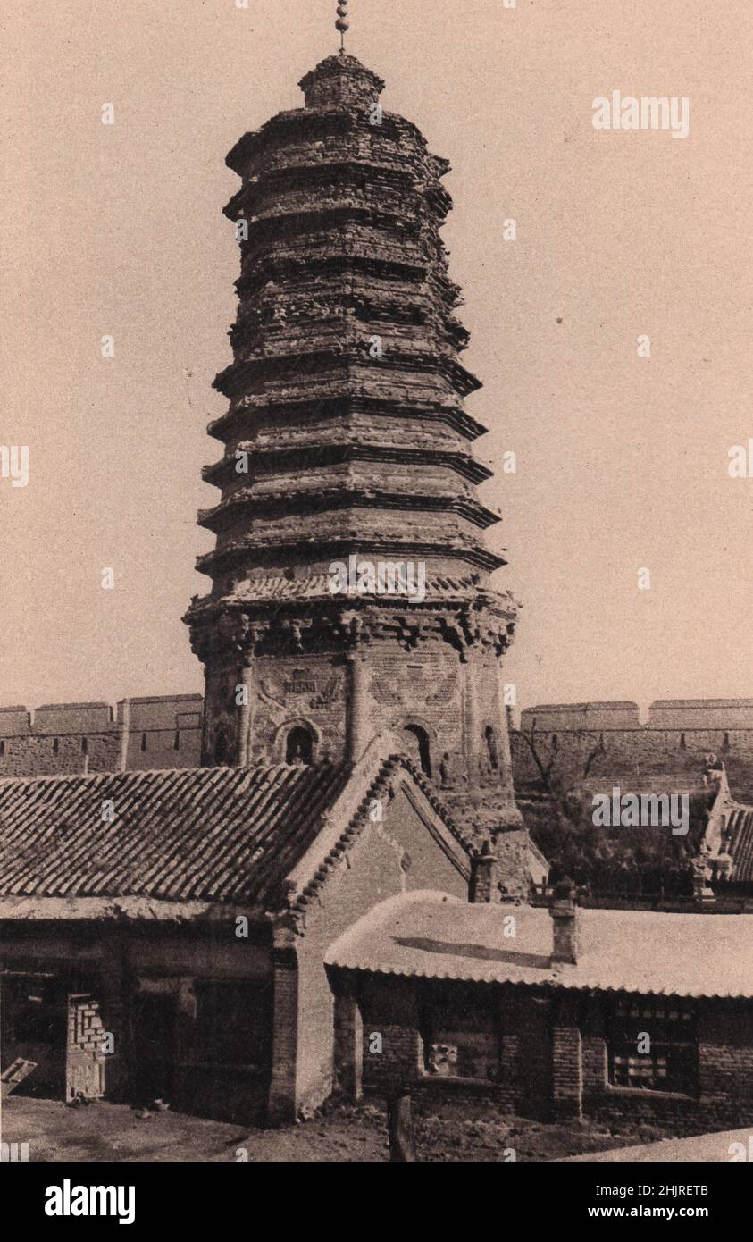 This huge and weather-worn La-ma-ta, or Tower of Lama, reputed to be 2,000 years old, dominates the west of Mukden. China. Manchuria (1923) Stock Photo