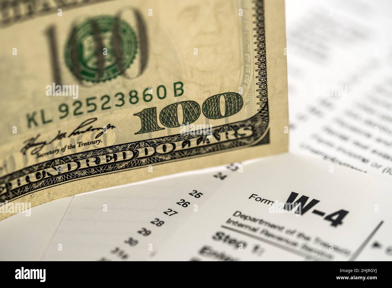 US tax form w4 w9 with money Stock Photo