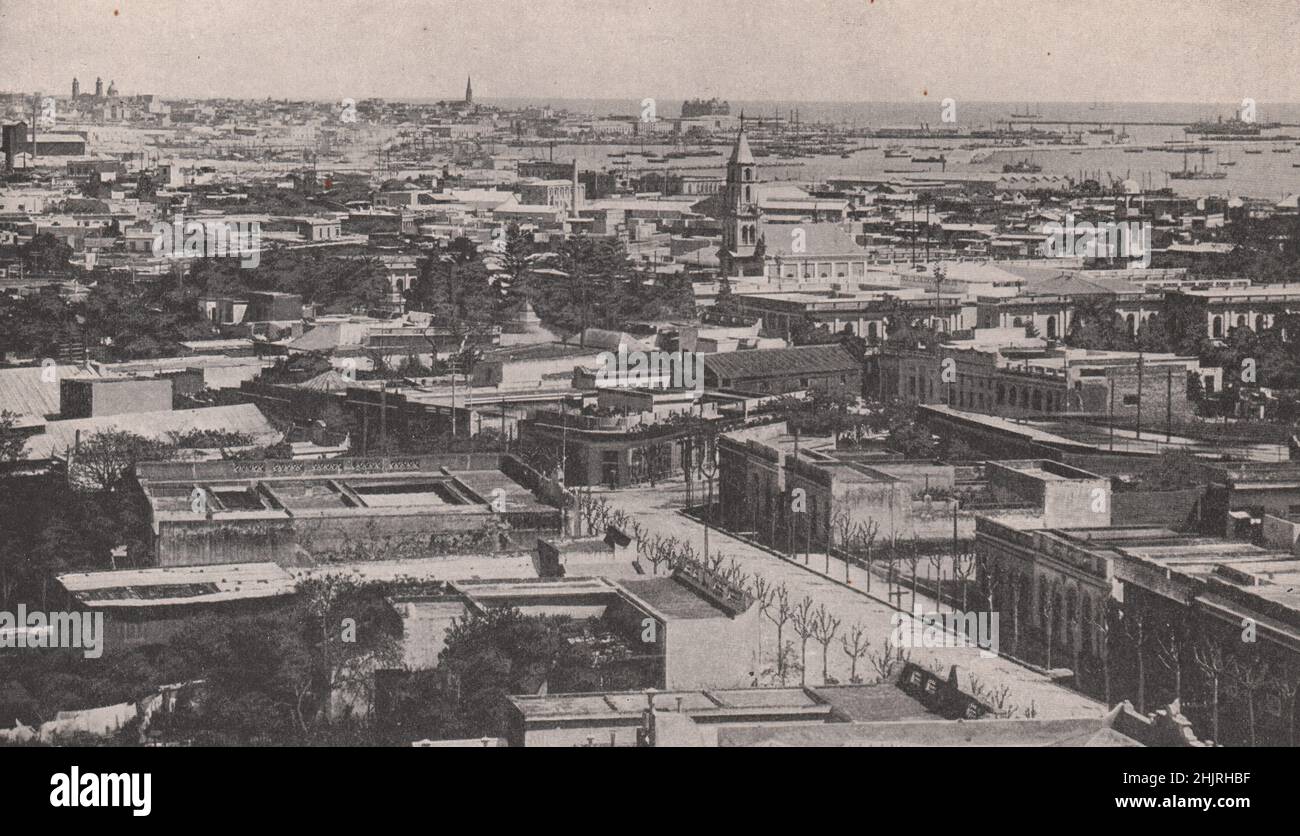 Huddled buildings of Montevideo lining the bay and magnificent inner harbour. Uruguay (1923) Stock Photo