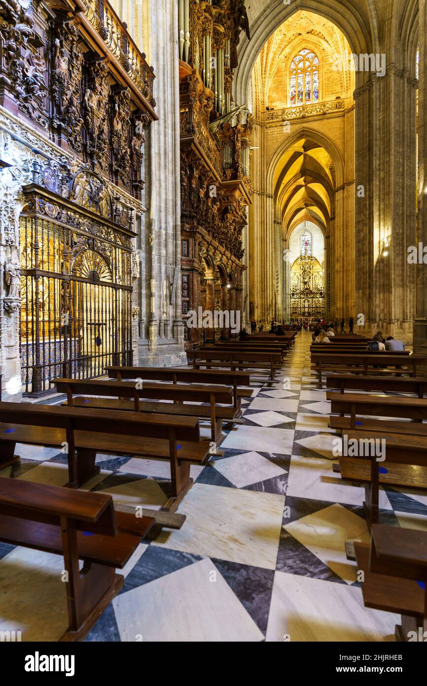 Seville, Spain - November 09 2021: Interior view of the  impressive cathedral of Seville, aka the  Cathedral of Saint Mary of the See, that dates back Stock Photo