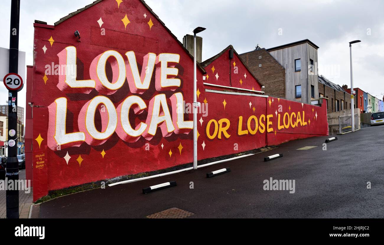 Bristol street art by artist Tozer, wall mural “Big Red” Love Local or Lose Local Stock Photo
