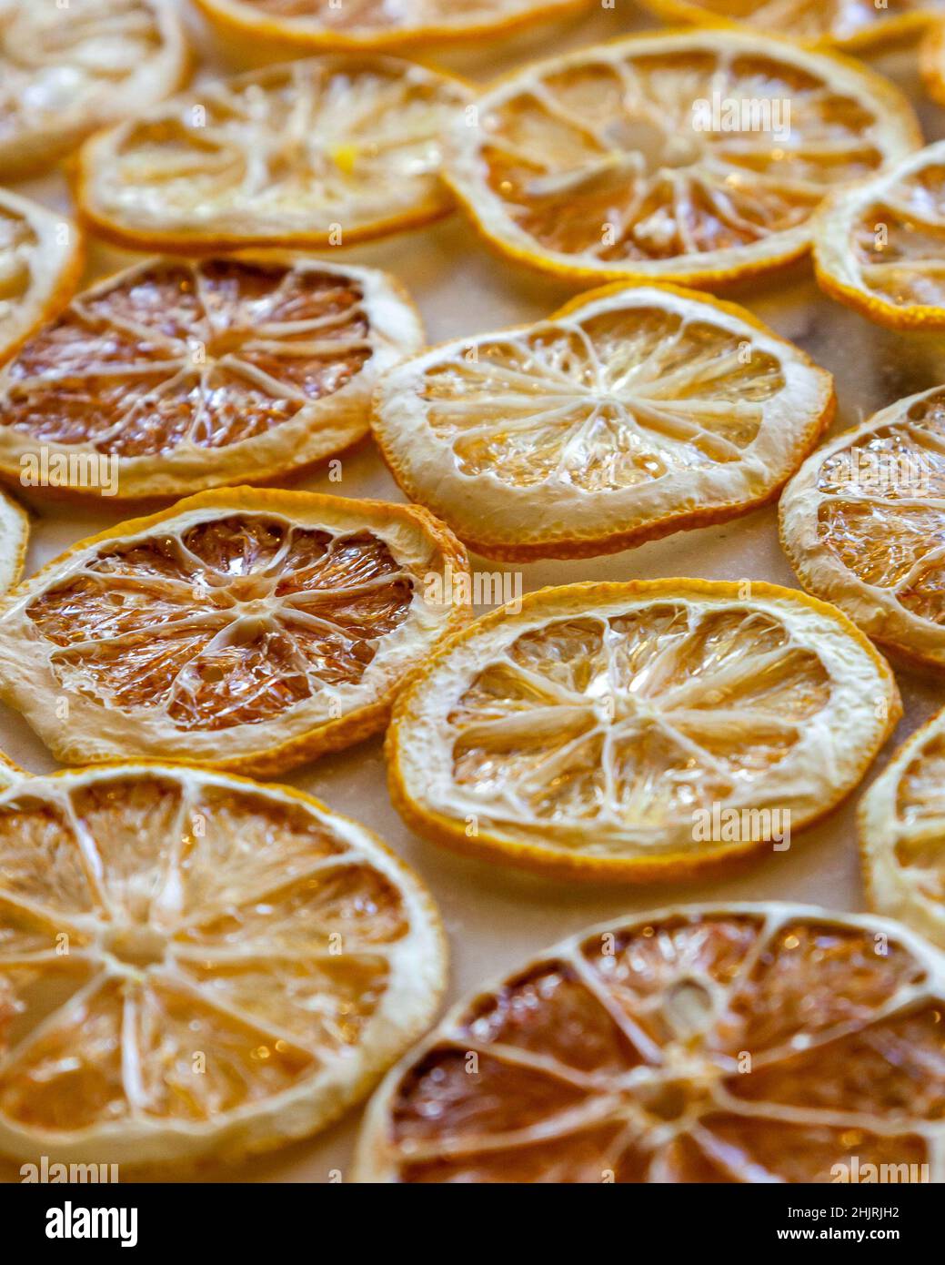 Dried oranges and lemons on a marble counter Stock Photo