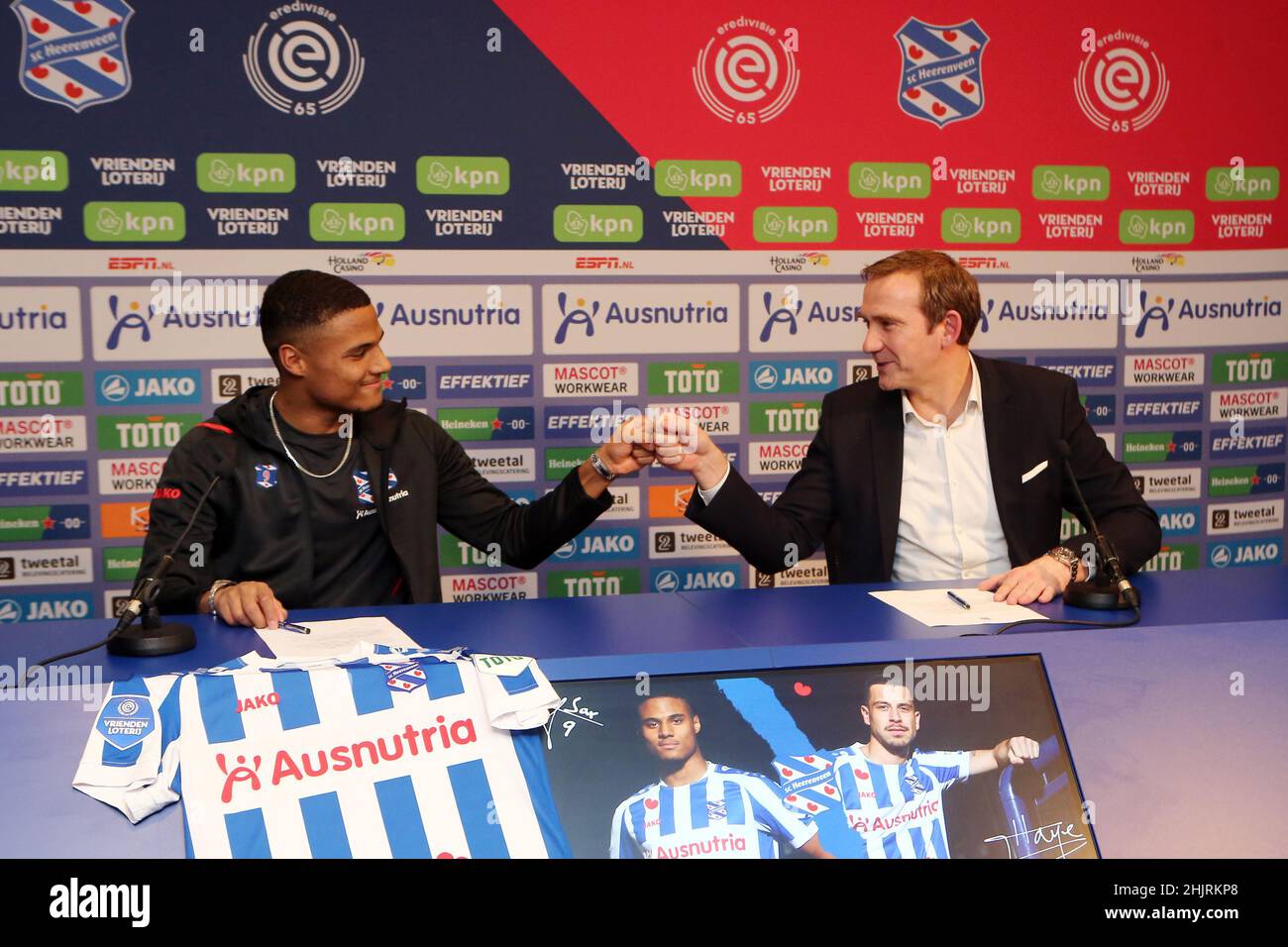 HEERENVEEN, NETHERLANDS - JANUARY 31: Amin Sarr poses with technical manager Ferry de Haan during his presentation as new player of SC Heerenveen at Abe Lenstra Stadium on January 31, 2022 in Heerenveen, Netherlands (Photo by Orange Pictures) Stock Photo