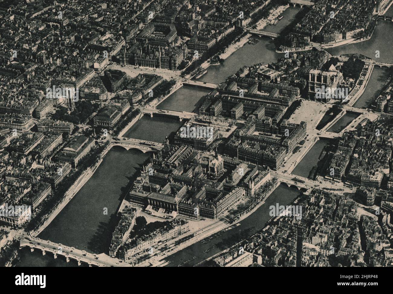 Ile de la Cité. Palais de Justice, Sainte Chapelle & the Conciergerie, Tribunal de Commerce & in the distance Notre Dame. Paris  (1923) Stock Photo