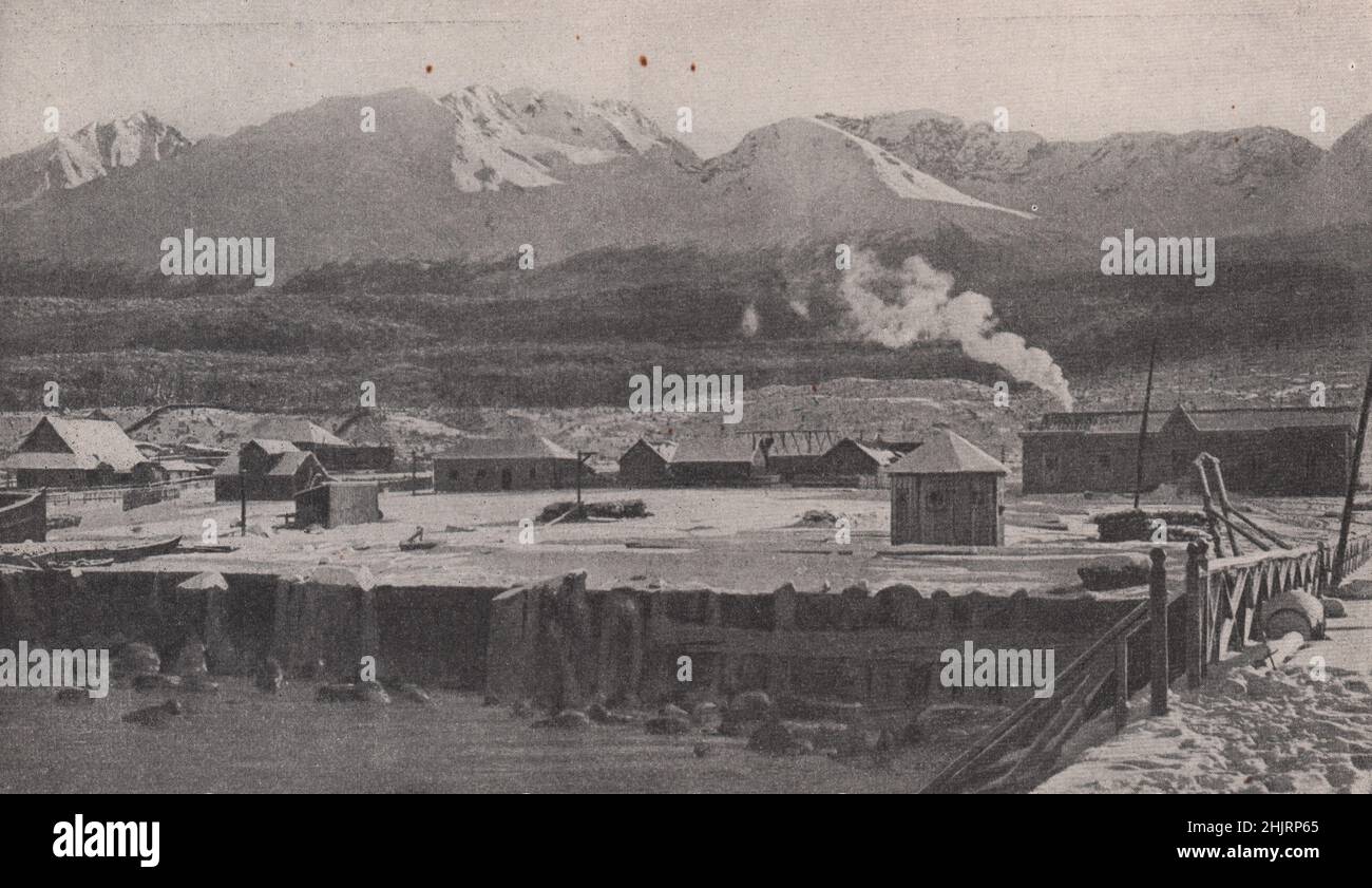 Wooden houses in the little settlement of Ushuaia beneath the winter snow. Argentina. Patagonia (1923) Stock Photo