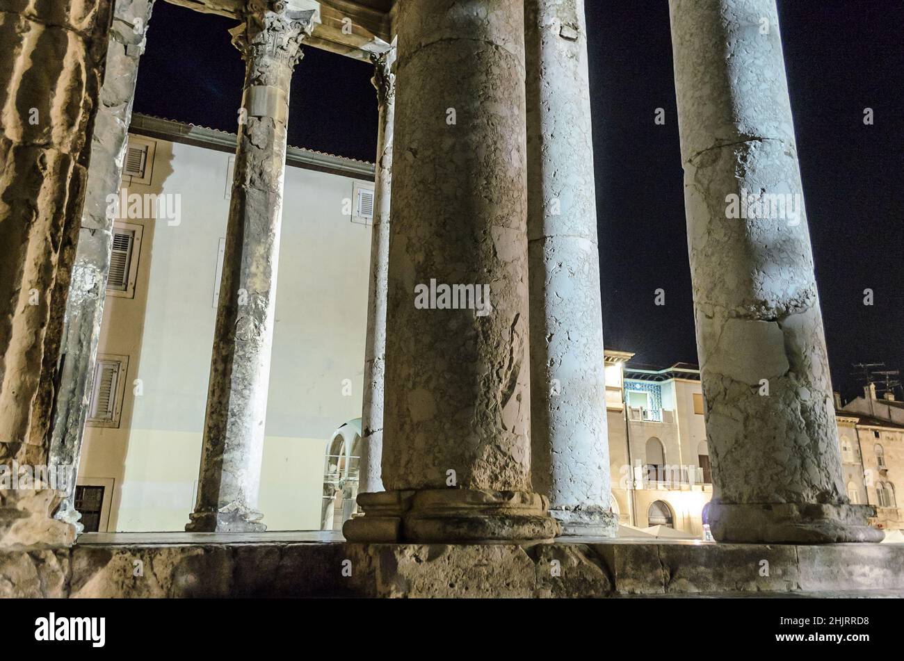 The Ancient Roman Temple of Augustus at Night. A Well Preserved Monument. Unique Architectural Greek Classical Style. Close up View of the Columns Stock Photo