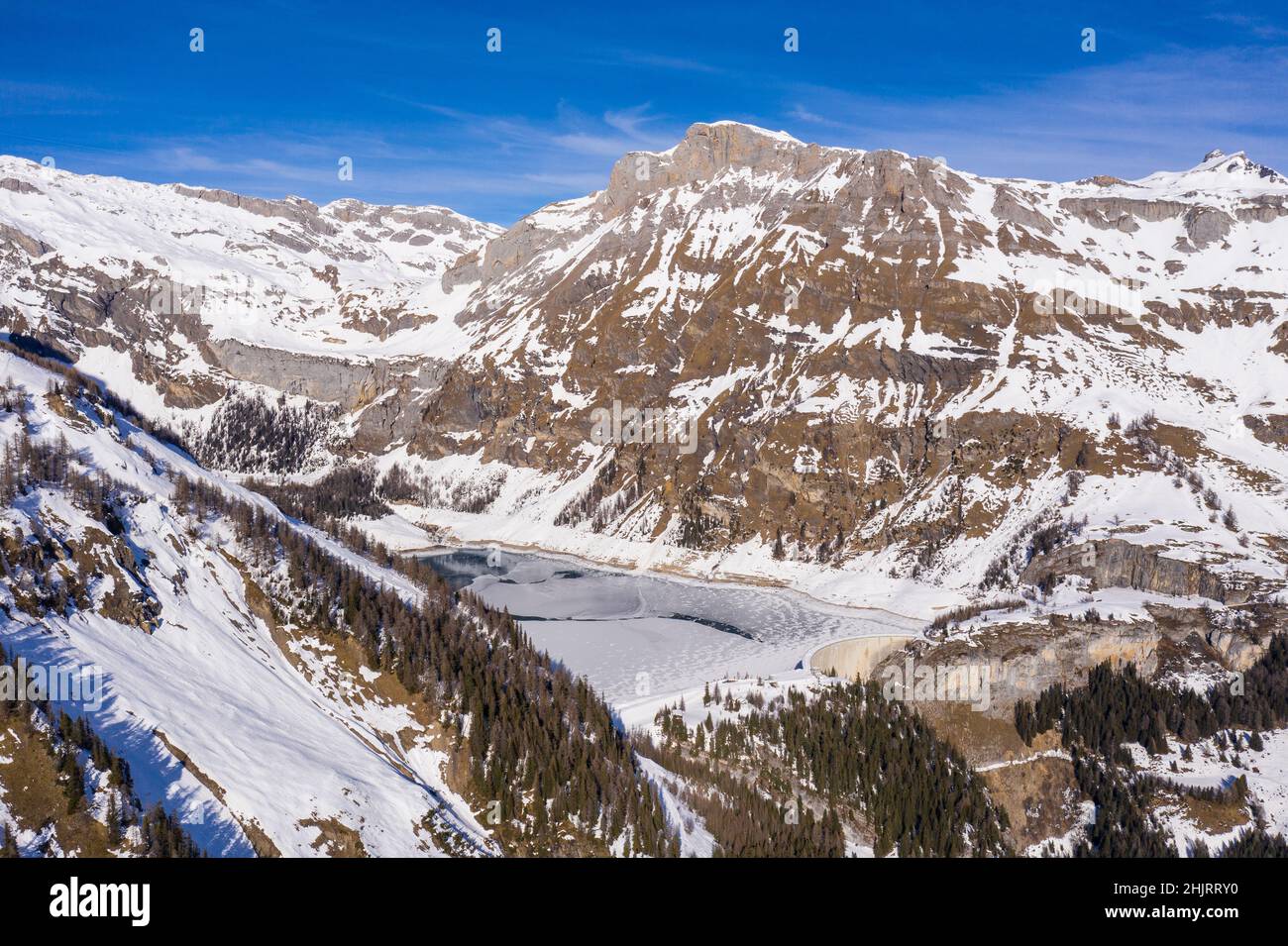Aerial view of the Tseuzier dam in the alps in winter near Crans Montana in Canton Valais in Switzerland Stock Photo