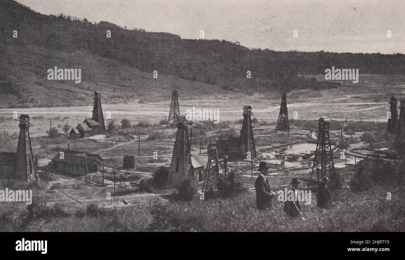 Rumanian Petroleum Industry: Oil wells at bustenari sunk in the river bed in the Prahova Valley. Romania (1923) Stock Photo