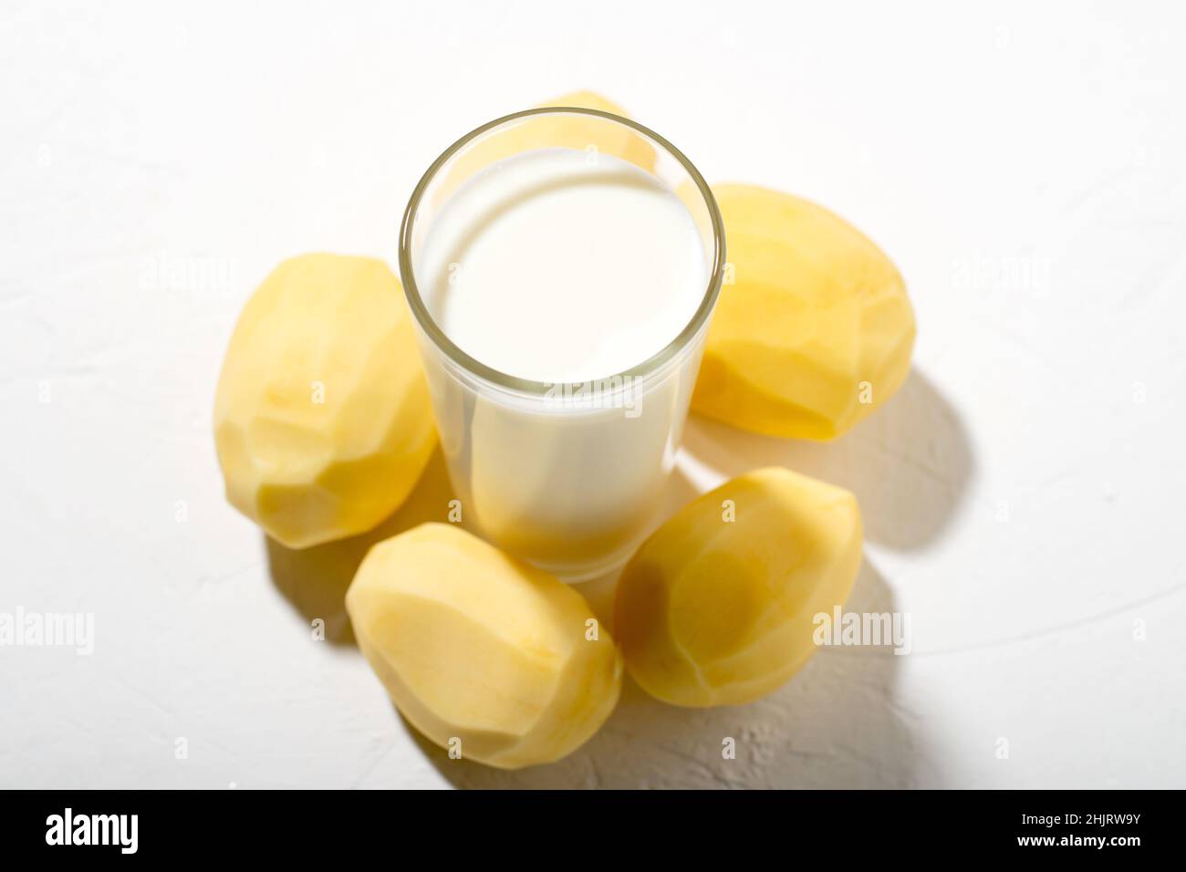 Potato milk is the new and trending plant-based alternative. Milk from potato concept. Allergy free milk. Stock Photo