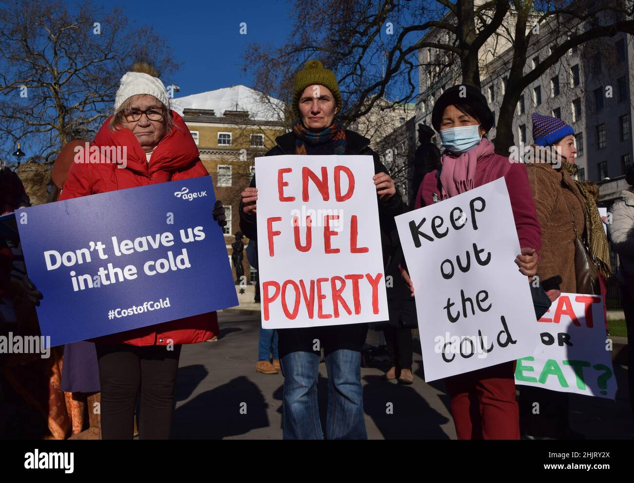 London, UK. 31st Jan, 2022. Protesters hold placards calling for an end to fuel poverty and help with heating bills, during the rally.Charity organisation, Age UK was joined by demonstrators outside Downing Street as they delivered a letter to Boris Johnson signed by over 97700 people, urging the government to help elderly people with their energy bills. One million older people live in fuel poverty and are unable to afford the cost of heating during winter. (Photo by Vuk Valcic/SOPA Images/Sipa USA) Credit: Sipa USA/Alamy Live News Stock Photo