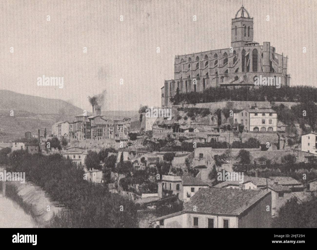 Town of Manresa lying beneath the great cathedral. Spain (1923) Stock Photo