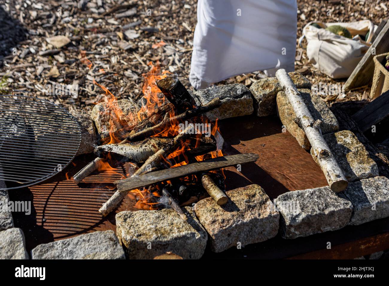 Chef preparing a fire for open fire cooking Stock Photo