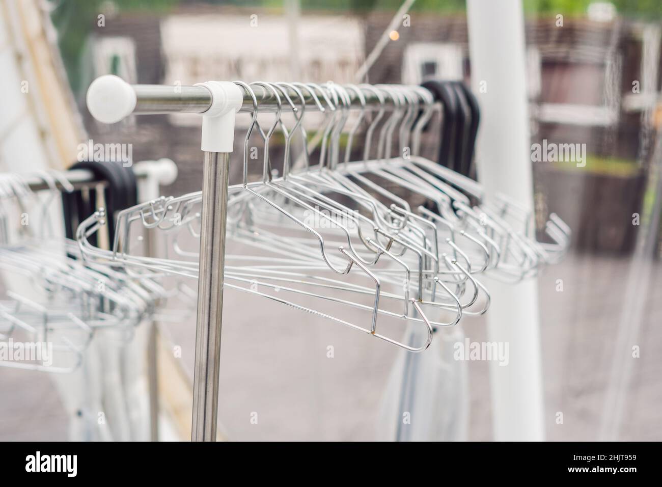 Iron empty clothes hangers. dry cleaning concept Stock Photo Alamy