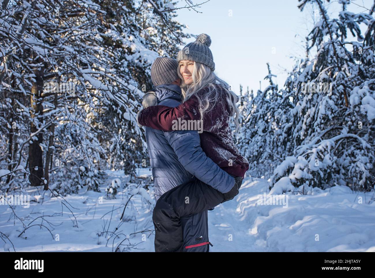 Couple hugs in winter forest hi-res stock photography and images - Alamy
