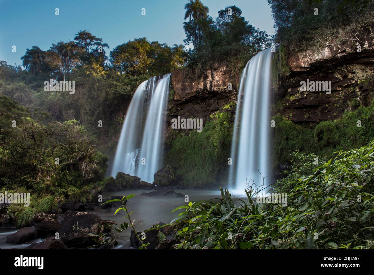 twin water drops in Cataratas del Iguazú National Park, called Sister jumps (Salto dos hermanas) between the jungle forest in Misiones, Argentina with Stock Photo