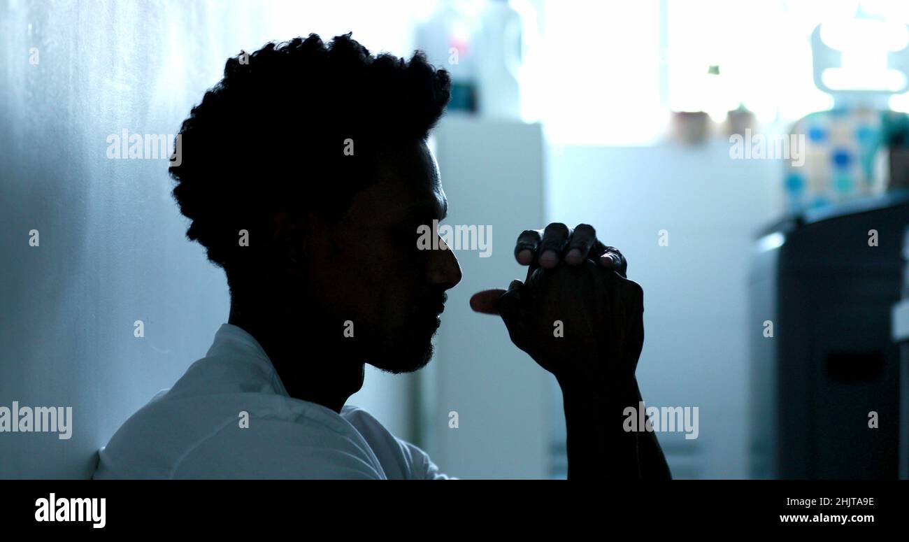 Worried black man feeling anxiety and worry Stock Photo - Alamy