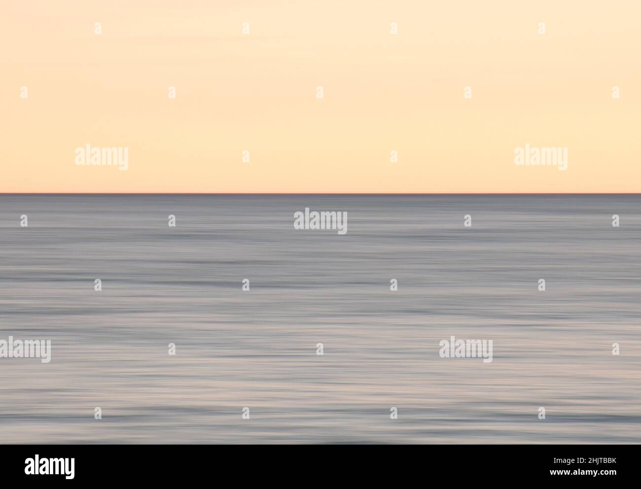 Beautiful photo of the sea at sunset and clear sky Stock Photo - Alamy