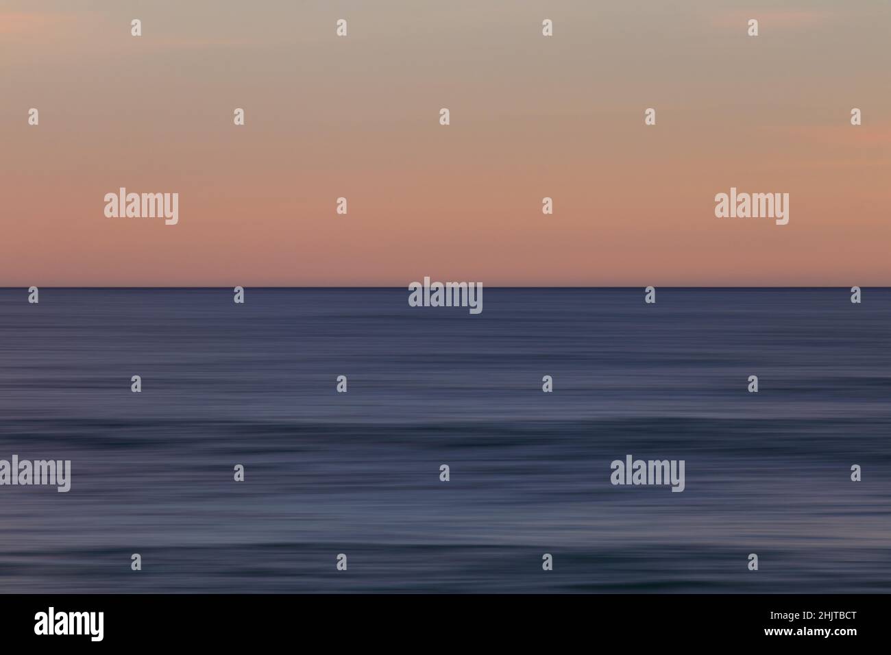 Beautiful photo of the sea at sunset and clear sky Stock Photo - Alamy